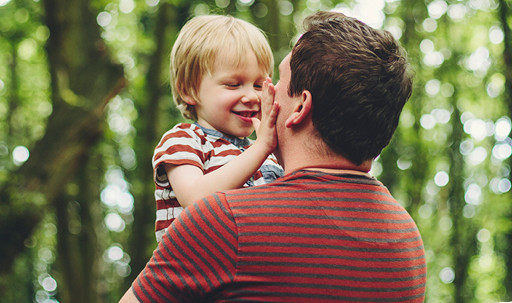 man and boy in woods